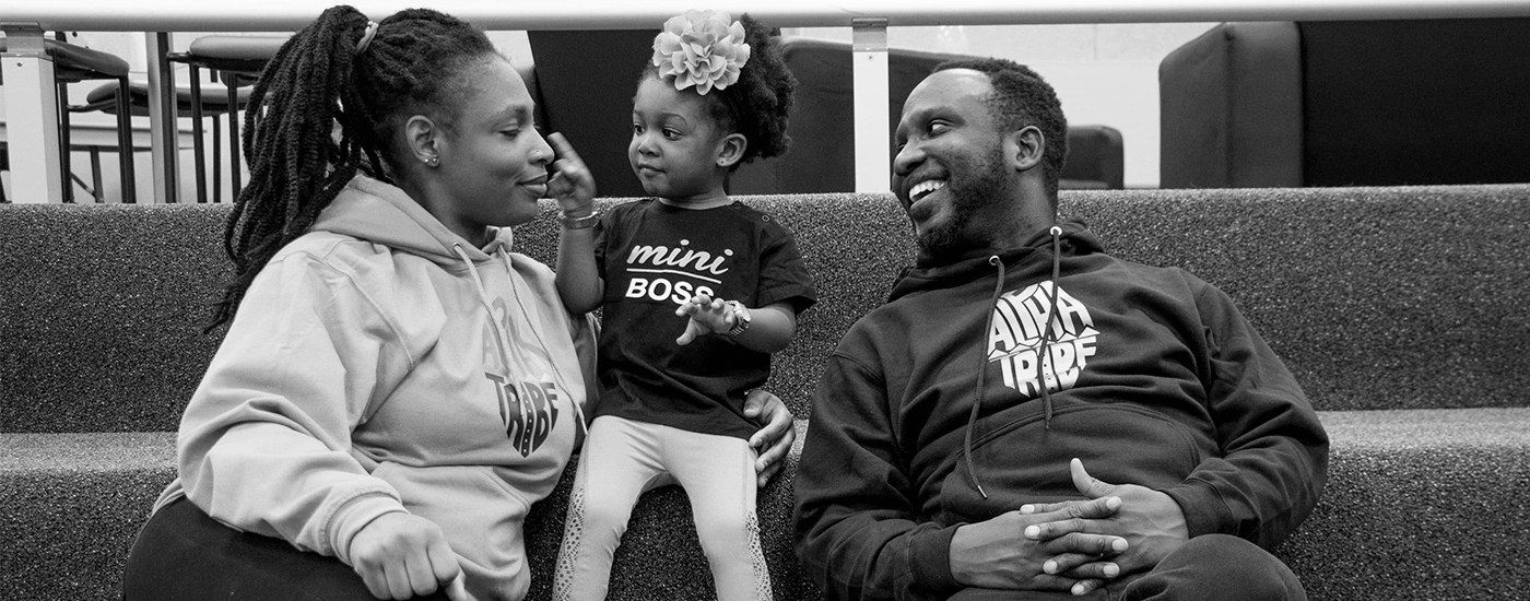 Happy family in matching hoodies.